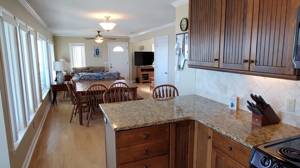 View from kitchen to dining, sitting areas
