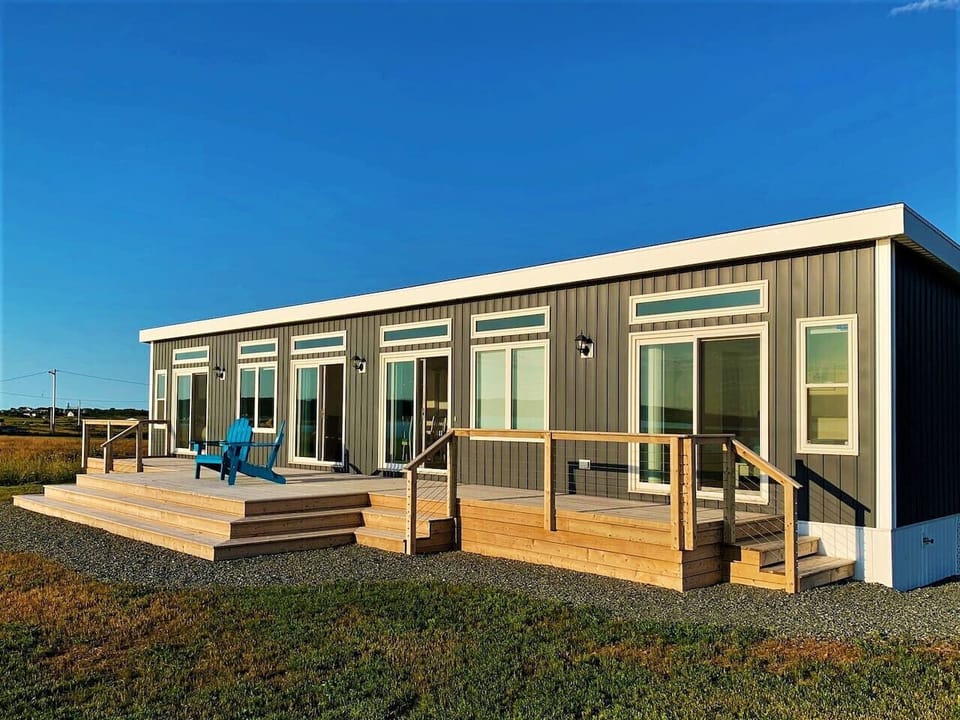 Welcome to this 2-bedroom, Executive Class modern beach house with ocean views from every room
