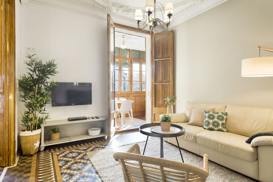 Living room, with a view of enclosed balcony