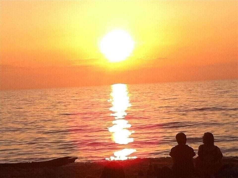Enjoy the Beautiful Sunsets at Nearby Harbert Beach, Less Than a 5 Minute Drive!