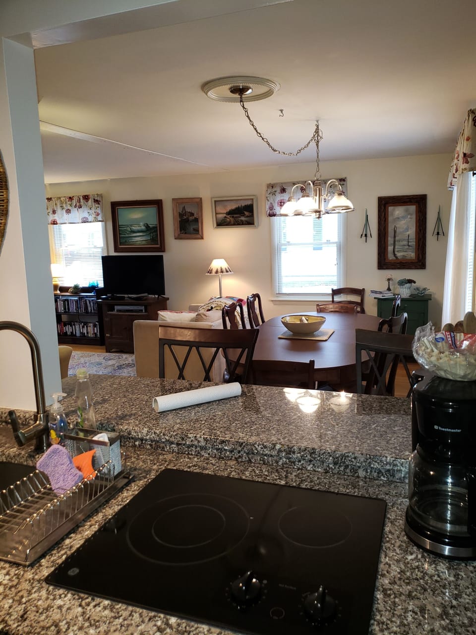 View from galley kitchen of bar and dining areas
