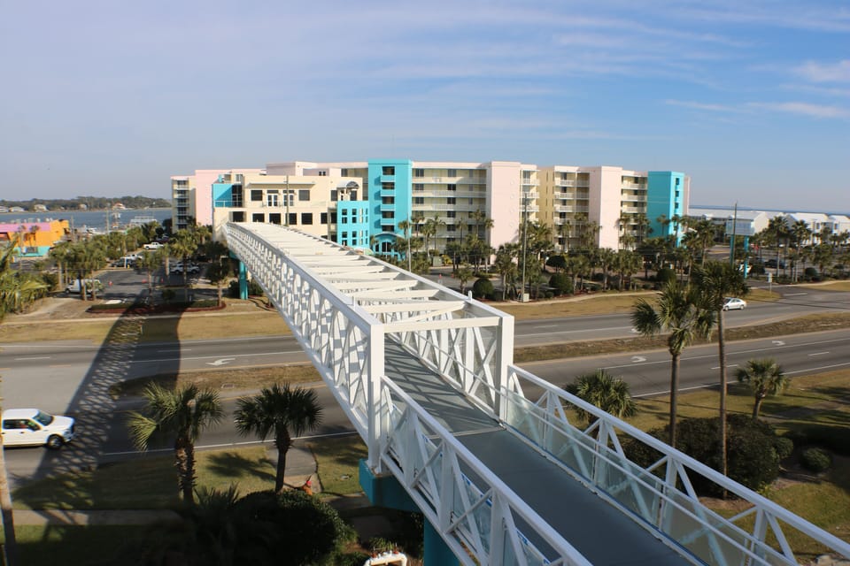 Pedestrian Bridge to Bayside  Lazy river and other pools/hot tubs.