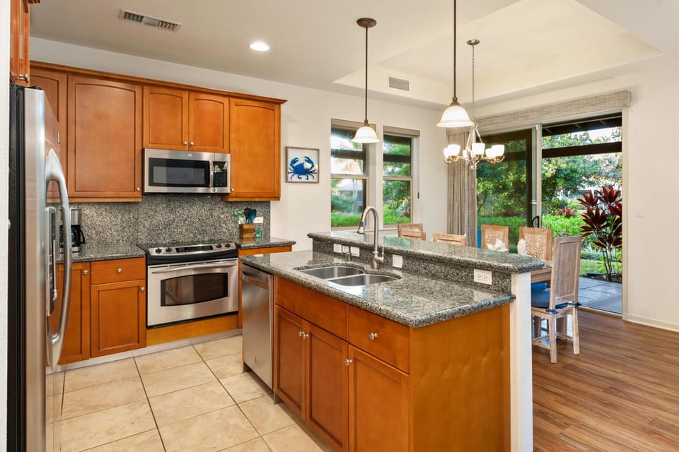 Full kitchen with granite counters and stainless steel appliances