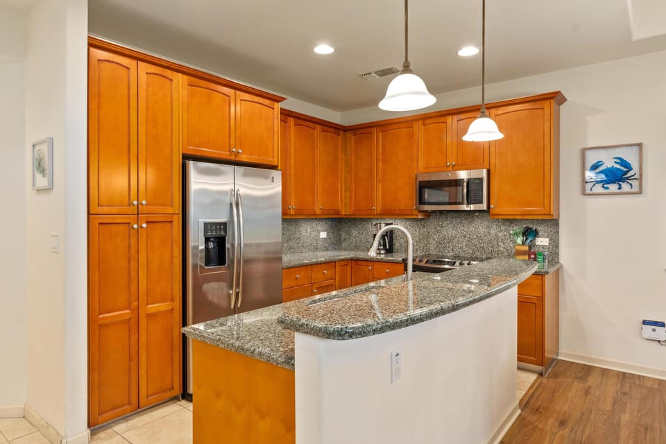 Full kitchen with granite counters and stainless steel appliances