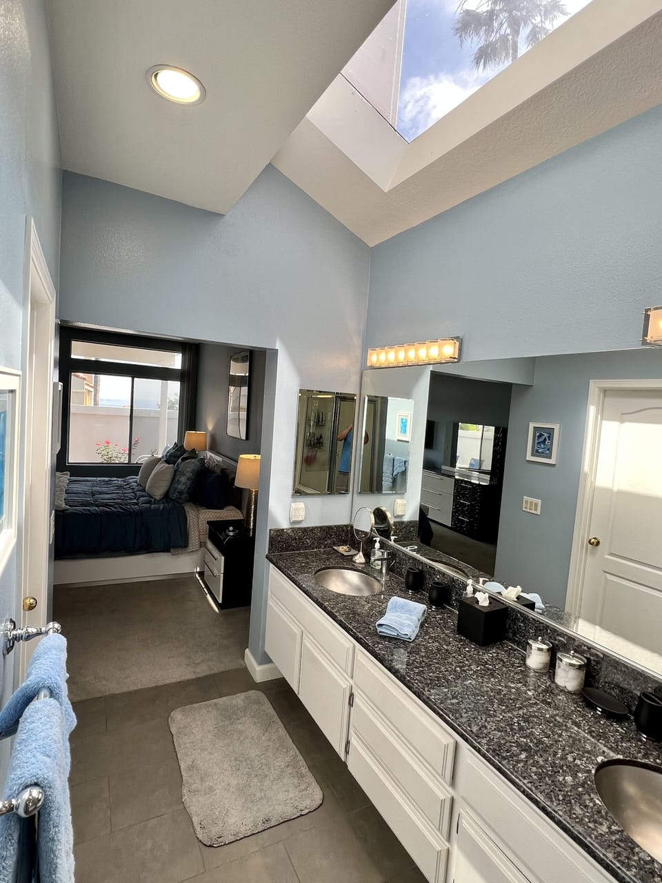 Private Master Bath with double vanity, walk-in closet and natural lighting