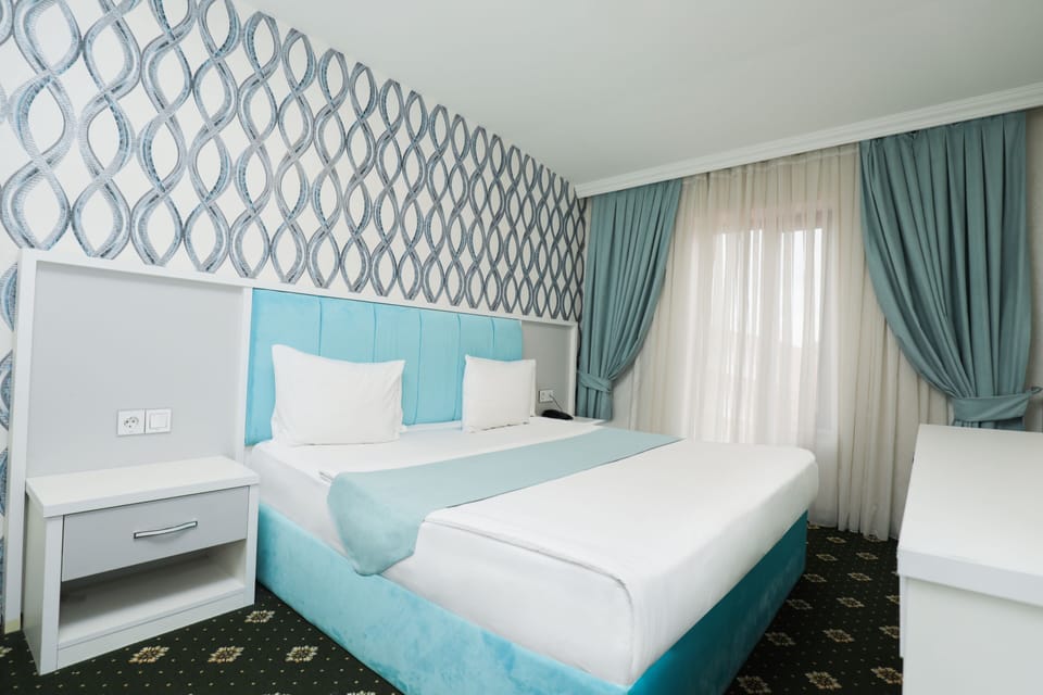 Economy Double or Twin Room, Pool Access, City View | Premium bedding, in-room safe, desk, laptop workspace
