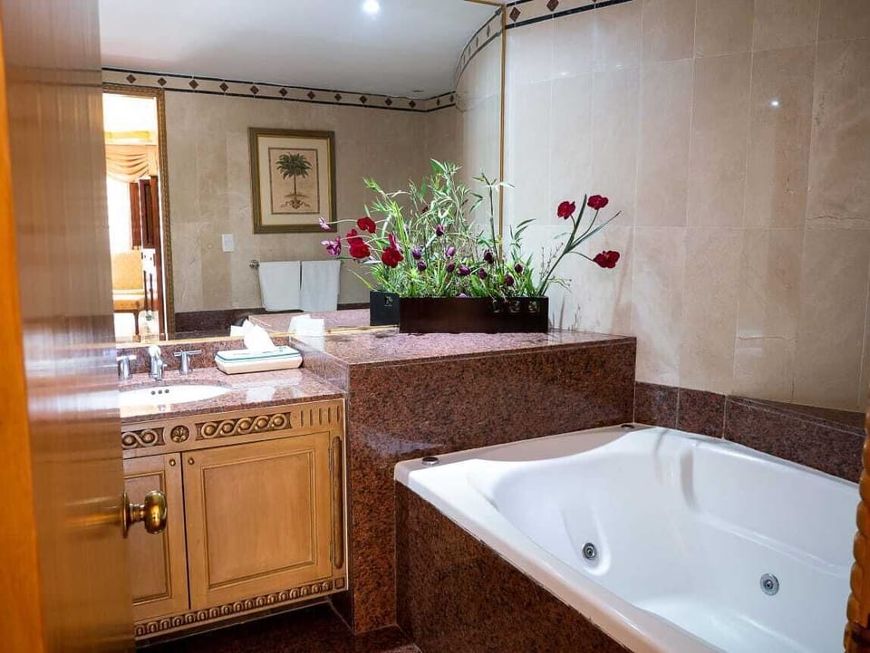 Luxury Suite, Multiple Beds, Non Smoking | Bathroom | Shower, free toiletries, hair dryer, towels