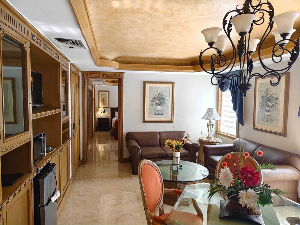 Luxury Suite, Multiple Beds, Non Smoking | Living area | Flat-screen TV