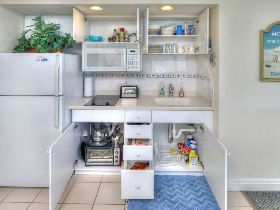 Appliances ready for your use: toaster, blender, coffee maker, microwave.