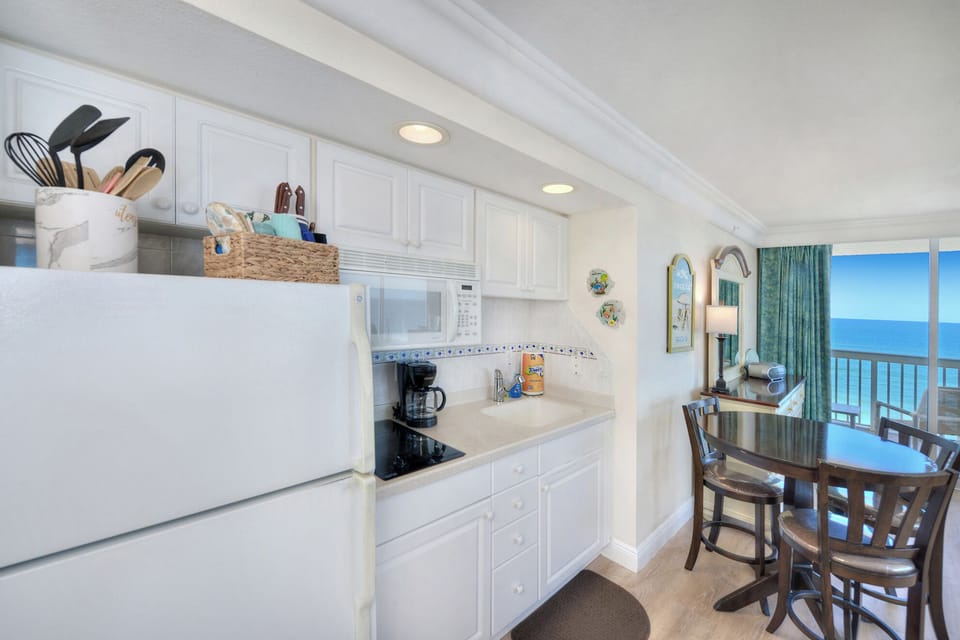 Your Daytona Beach Vacation includes a well-equipped kitchenette for convenience.