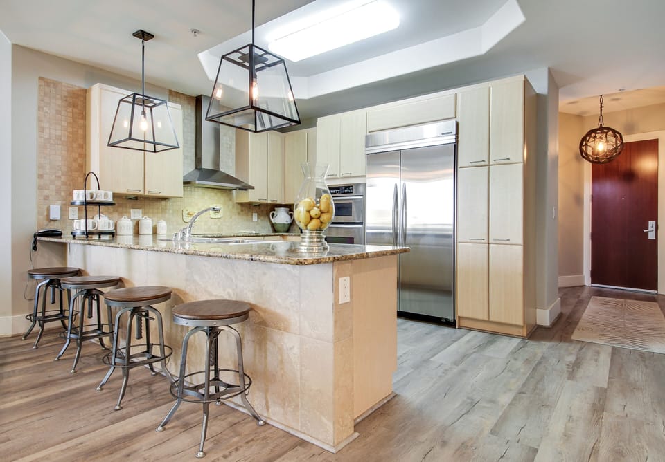 Restoration Hardware Lighting. Seating for 4 at the oversized kitchen Island.