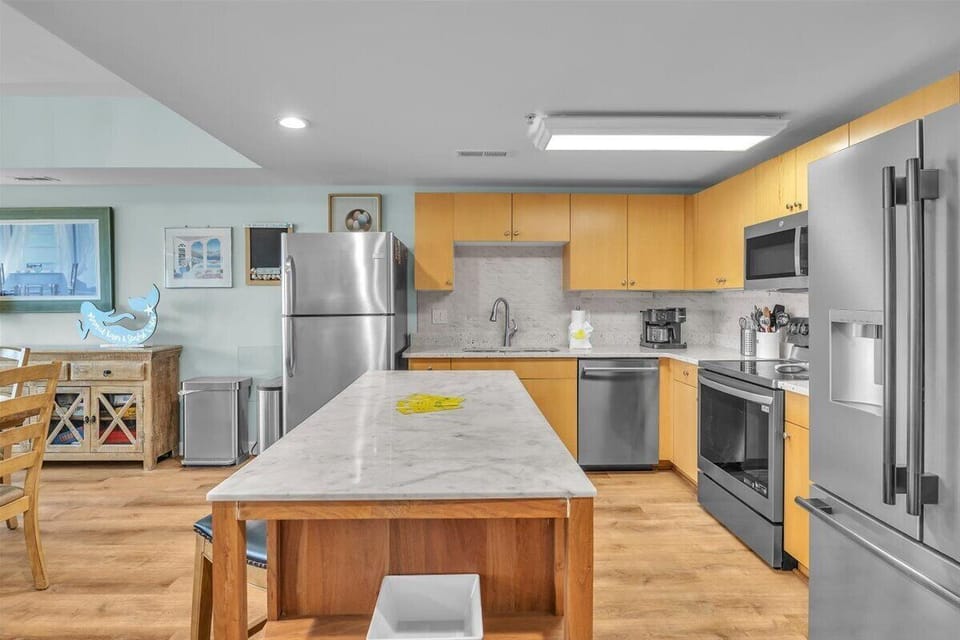 Kitchen with large island and 2 full size refrigerators 