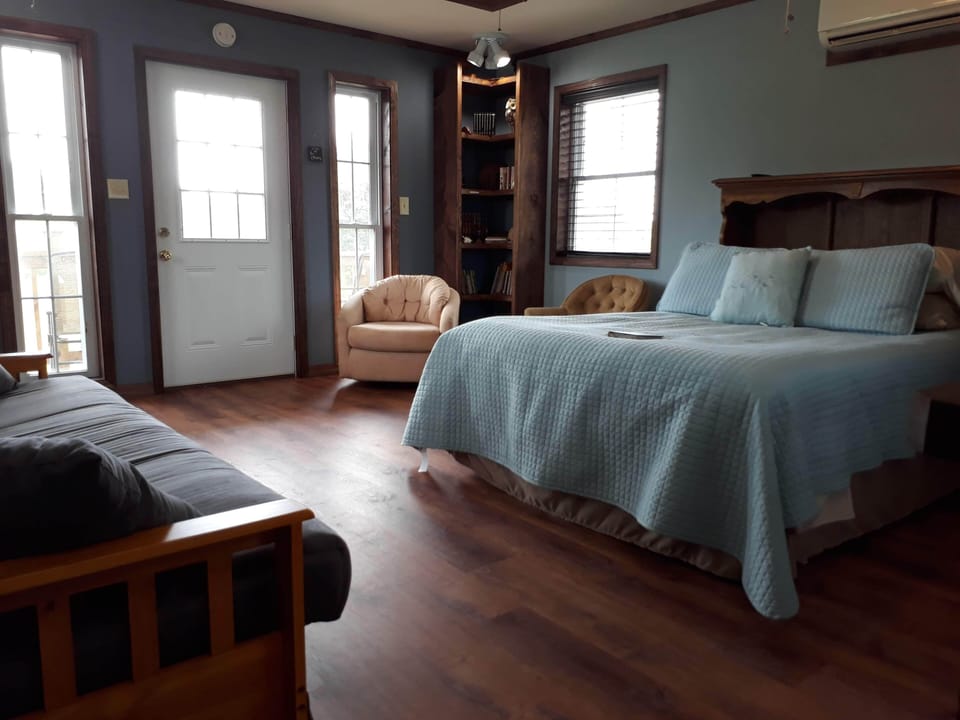 The second floor bedroom includes a king size bed and a reading nook.