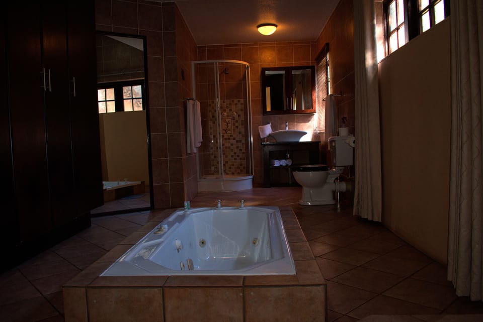 Presidential Suite, 1 King Bed | Bathroom | Deep soaking tub, hydromassage showerhead, towels