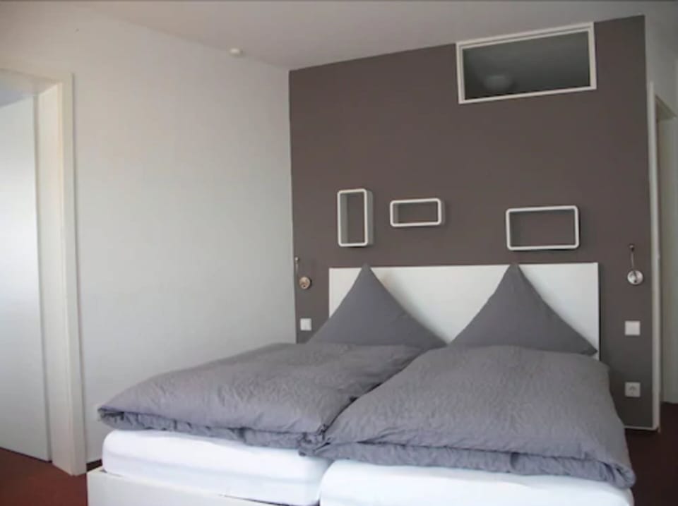 Family Room | Minibar, desk, blackout drapes, iron/ironing board