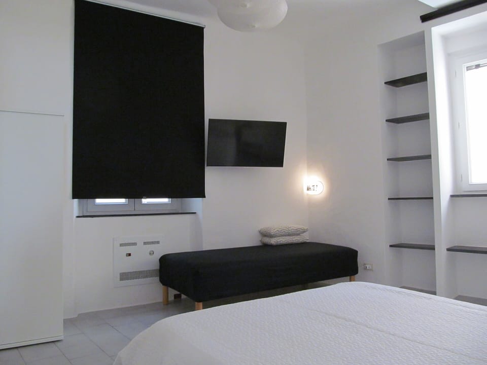 Triple Room | Desk, blackout drapes, iron/ironing board, free WiFi