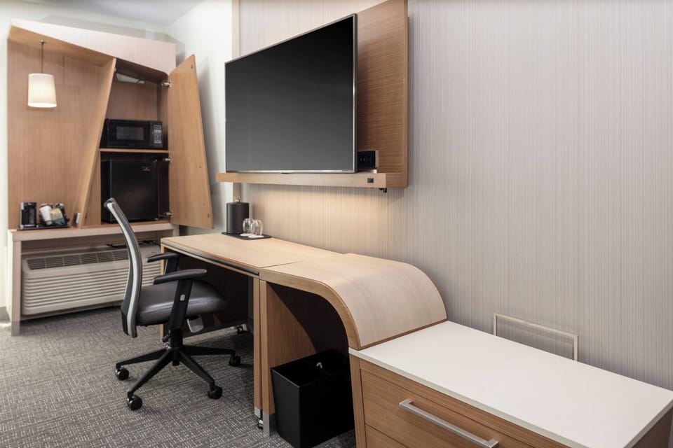 Individually furnished, desk, laptop workspace, iron/ironing board