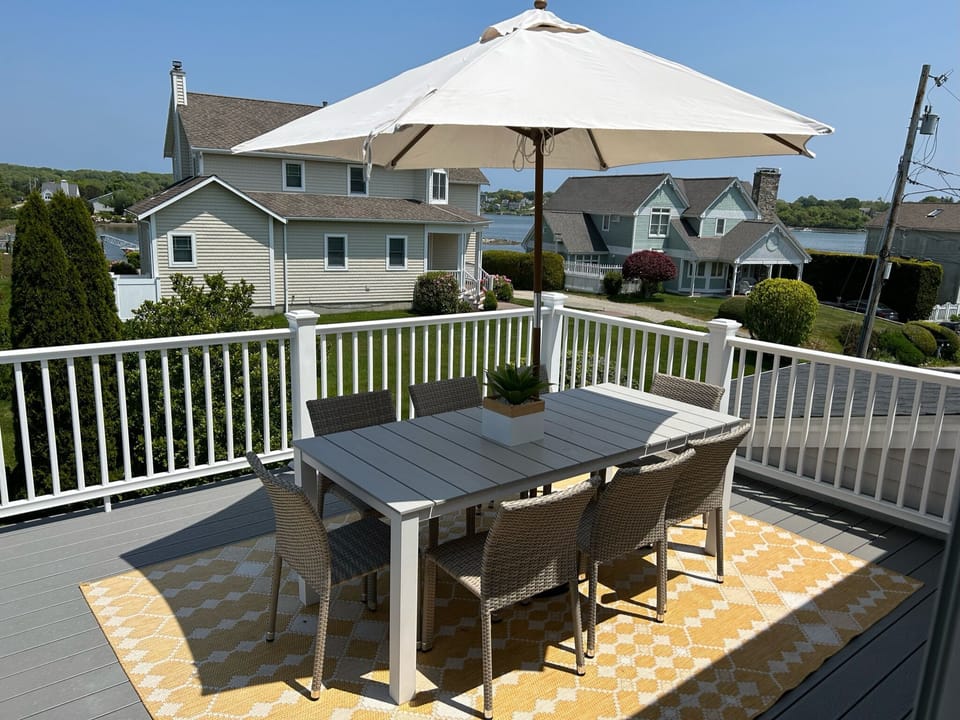 Upper deck off kitchen/living area with water views.