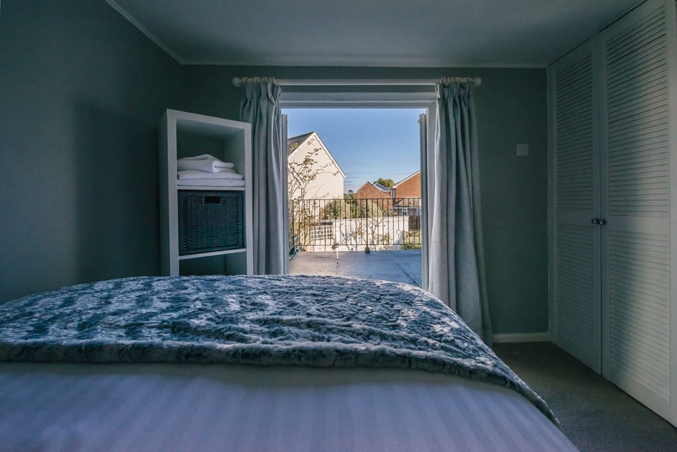 Double bedroom looking out onto its own terrace.