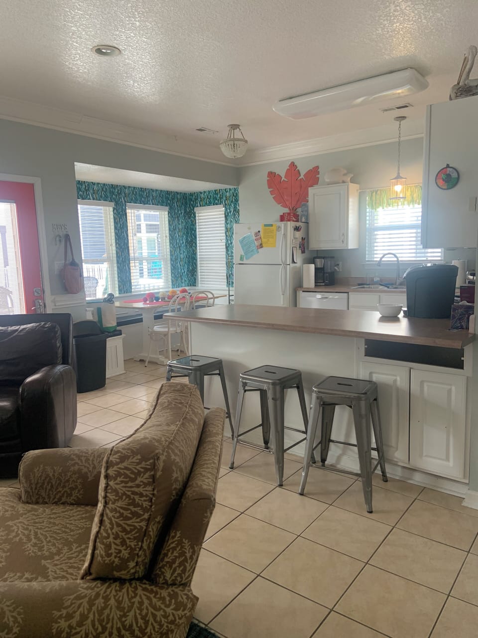 Kitchen with dining nook and bar seating