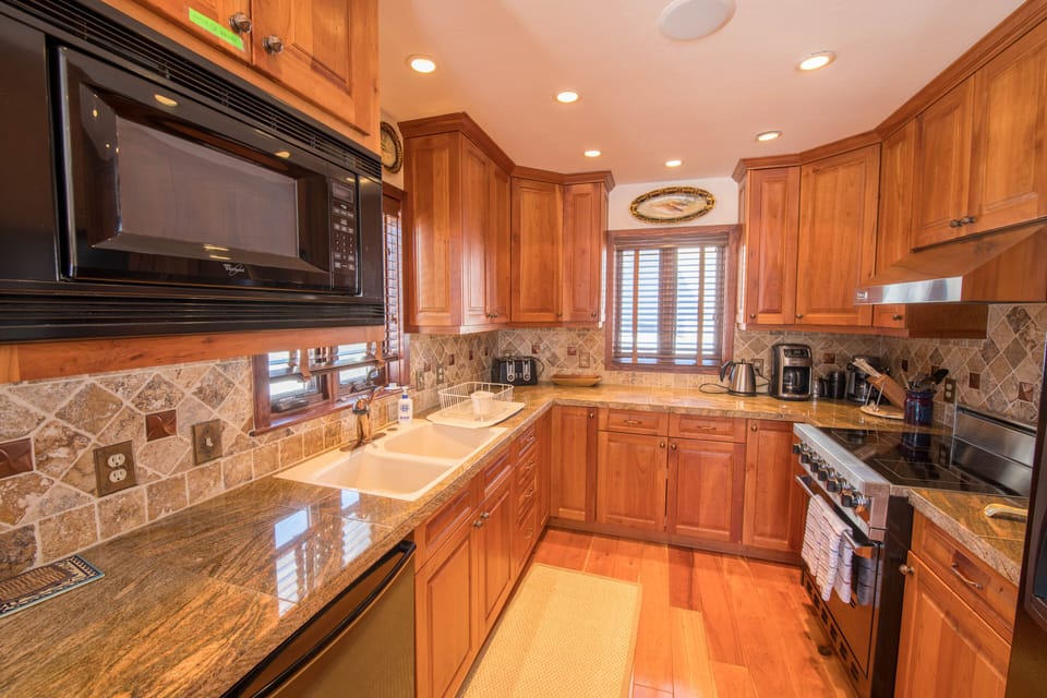 Kitchen with double sinks, Viking Range and dishwasher