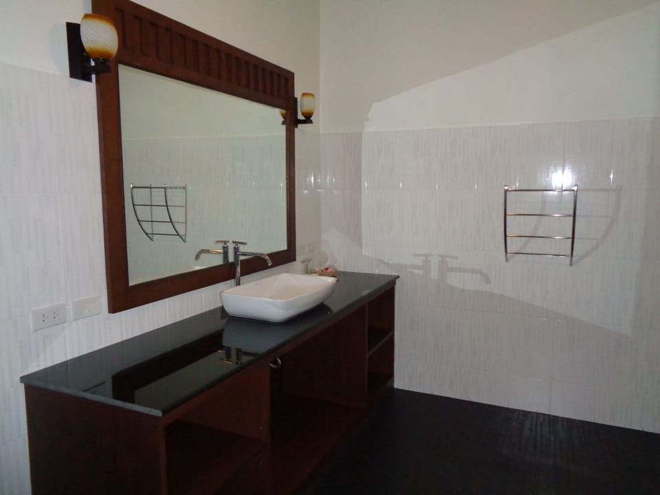 Shower, rainfall showerhead, slippers, towels