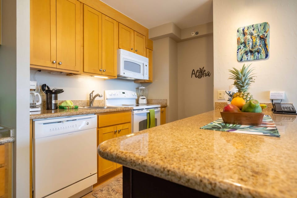 Granite countertops with abundant cabinet space.