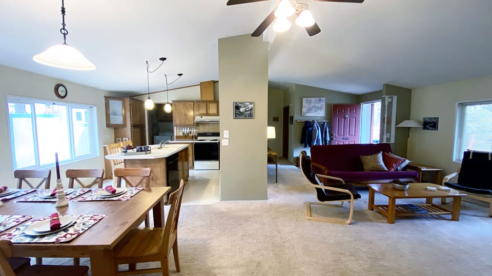The large space in the center of the cabin, with kitchen, dining & living rooms