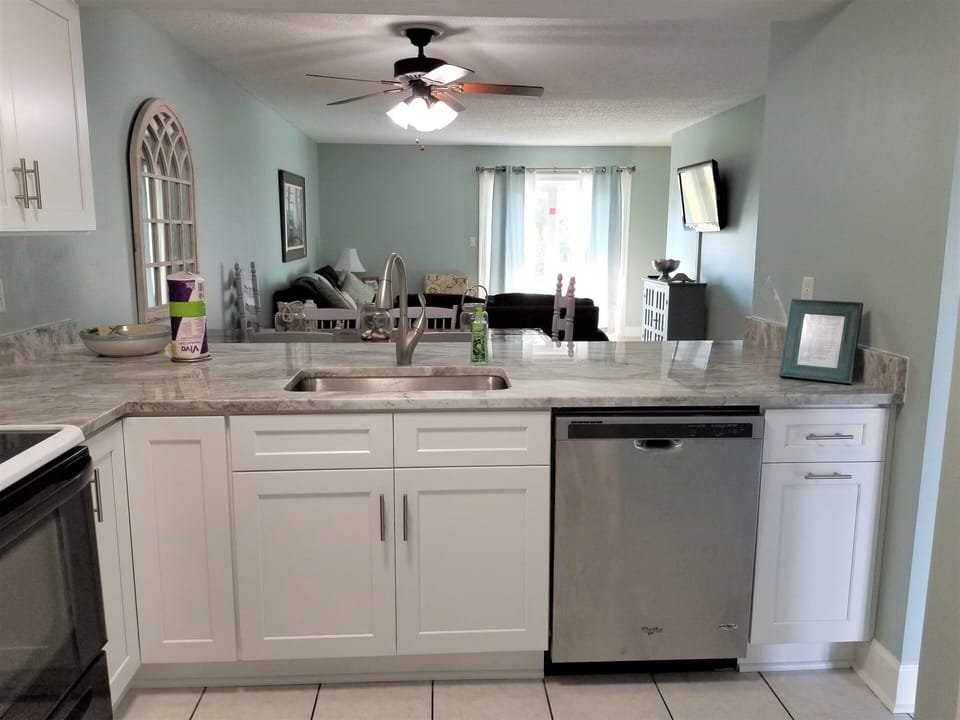Kitchen overlooks dinning and living space