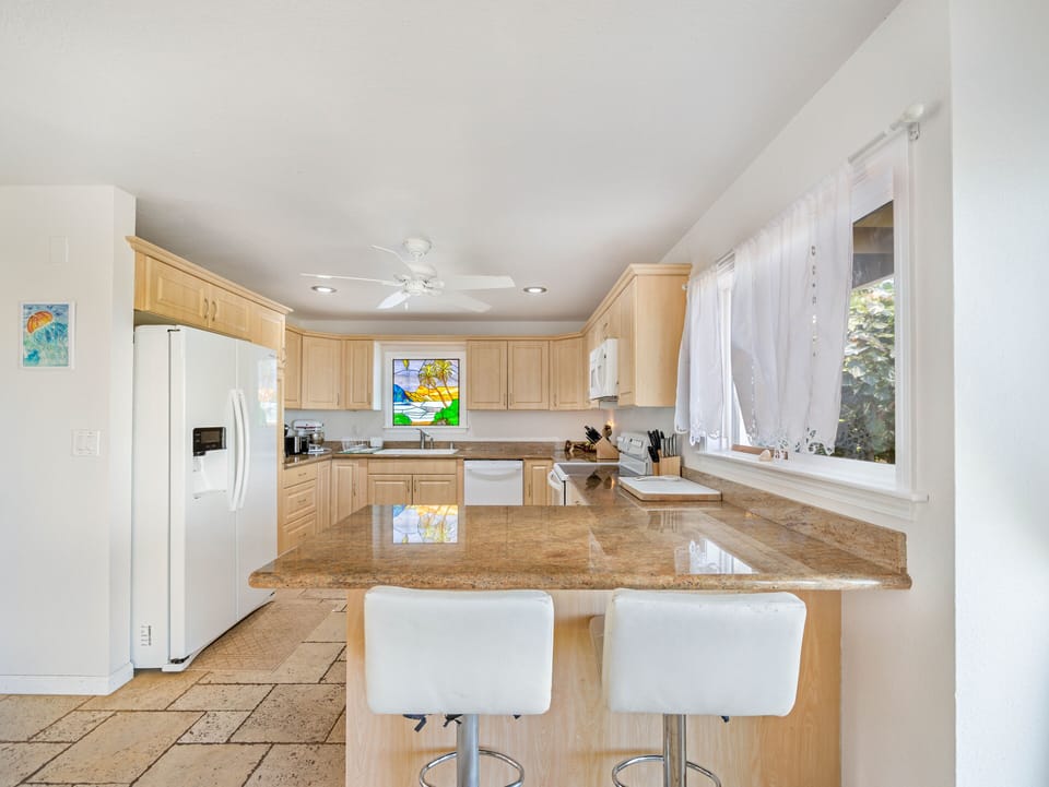 Large functional kitchen that flows out into the living space.