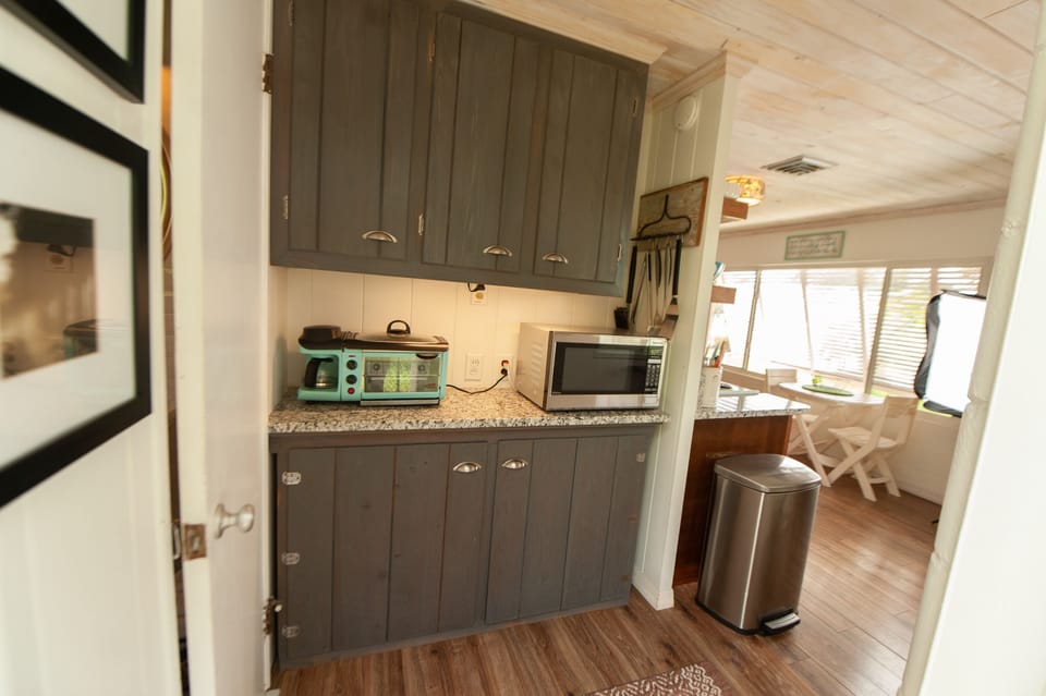 Pantry area, toaster over and microwave.