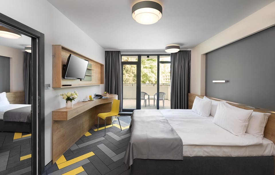 Family Room, Balcony | Free minibar, desk, blackout drapes, soundproofing