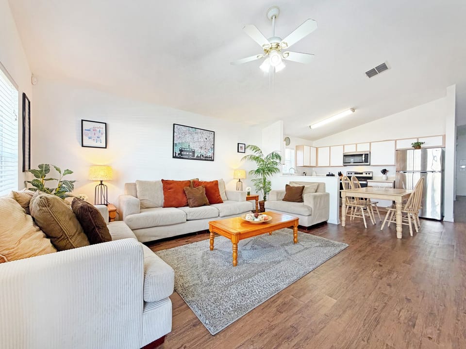 5 Spacious open plan Living Area with ceiling fan.JPG