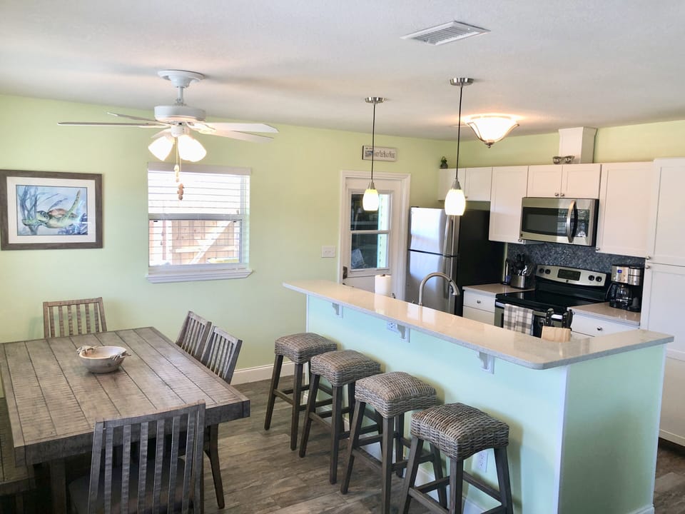 Table Seats 6 comfortably and counter seats 4.