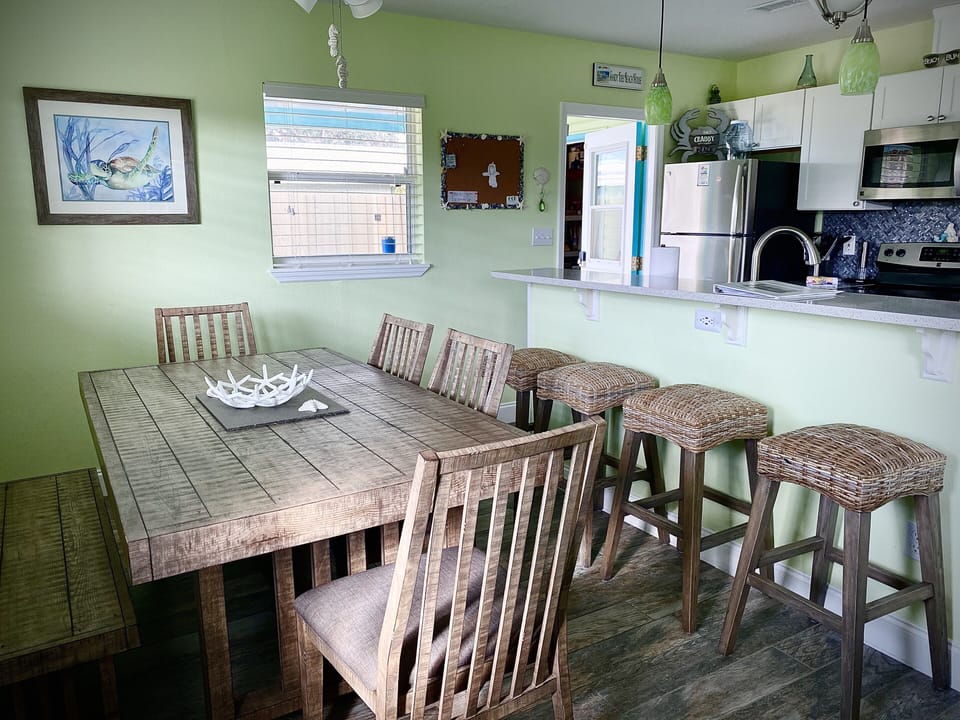 Dining area sits 6 at table and 3 at kitchen bar.
High end furniture 