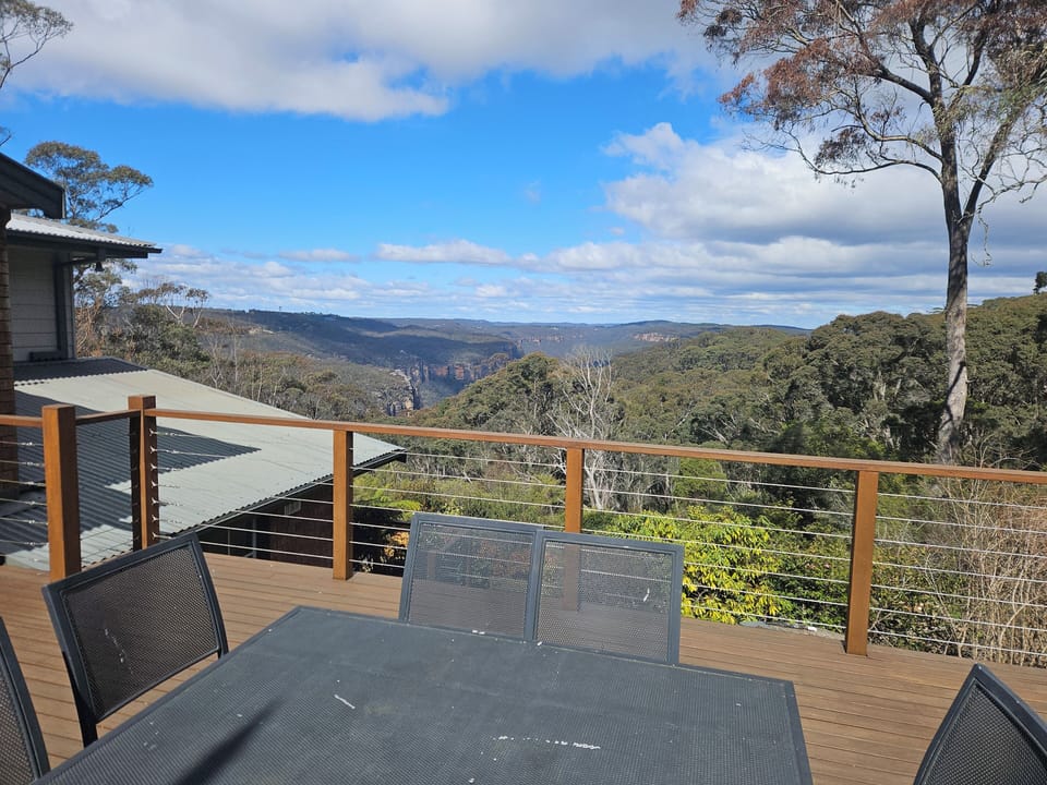 A huge sunny entertaining deck with a natural gas BBQ and view spanning 200KM's.