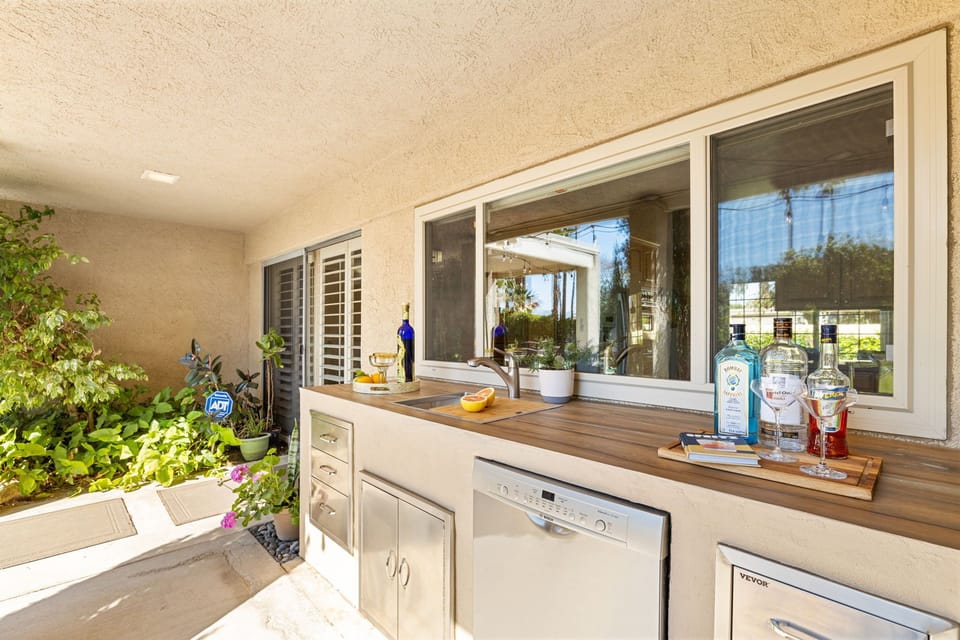 Outdoor kitchen with sink and dishwasher
