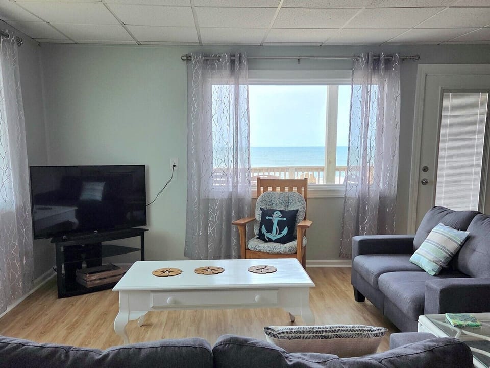 living room and door to deck