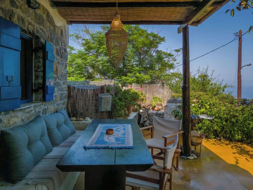 The terrace is surrounded by night flowers and has ample space for dining and enjoying the view.