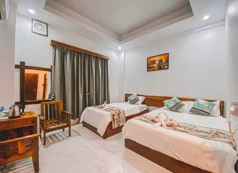 Family Room | Minibar, blackout drapes, free WiFi, bed sheets
