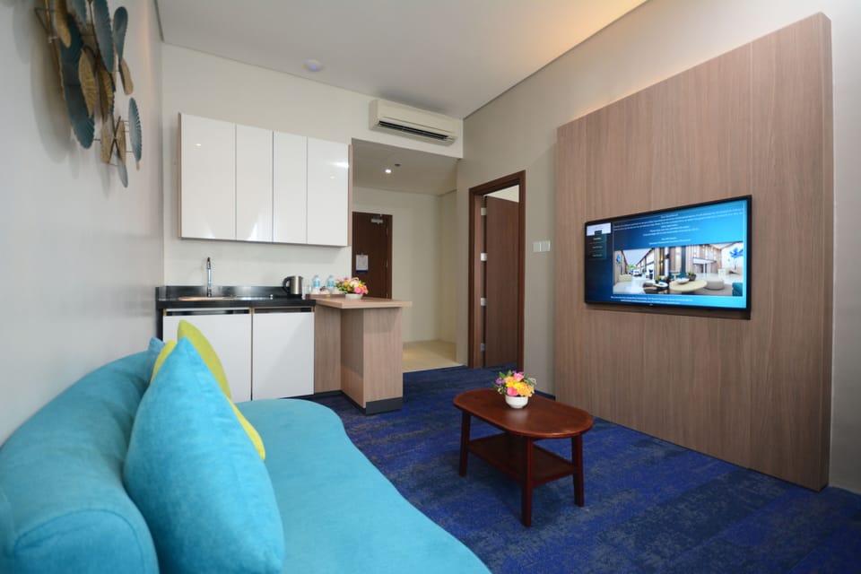 Lotus Suite | Living area | 49-inch LED TV with cable channels, TV