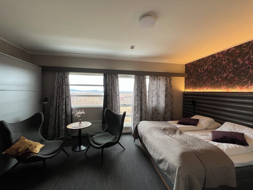 Superior Quadruple Room, Multiple Beds | Living area | 40-inch TV with satellite channels