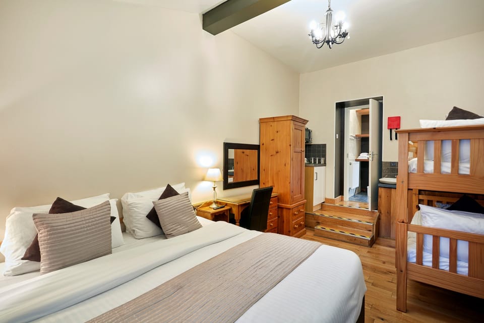 Family Room | Premium bedding, individually decorated, individually furnished, desk