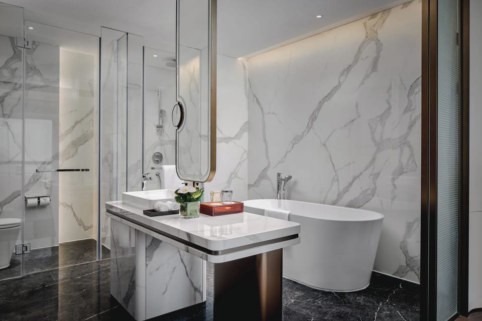 Suite, 1 Bedroom (Dining Area) | Bathroom | Free toiletries, hair dryer, bathrobes, slippers