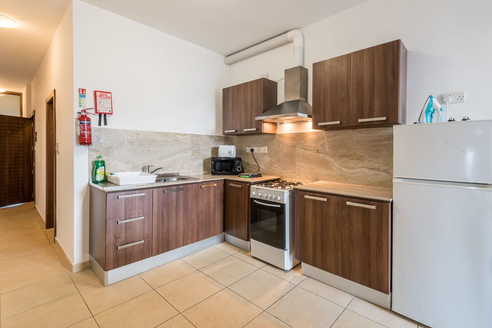 Comfort Apartment, Multiple Beds, Non Smoking, City View | Private kitchen | Full-size fridge, oven, stovetop, highchair