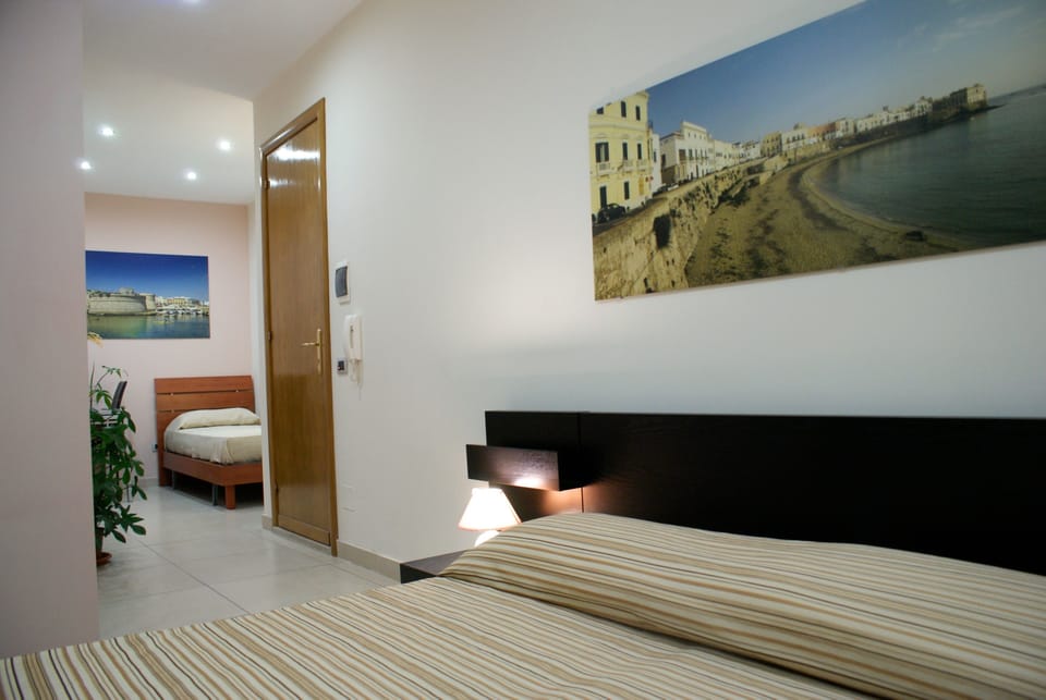 Standard Triple Room, Sea View | Premium bedding, down comforters, individually decorated