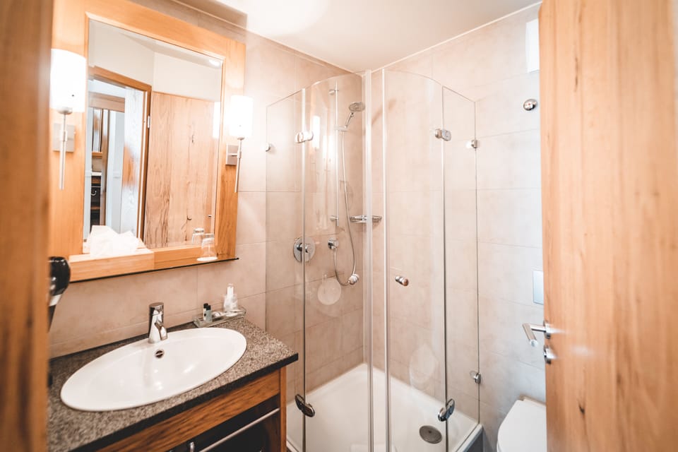 Shower, free toiletries, hair dryer, slippers