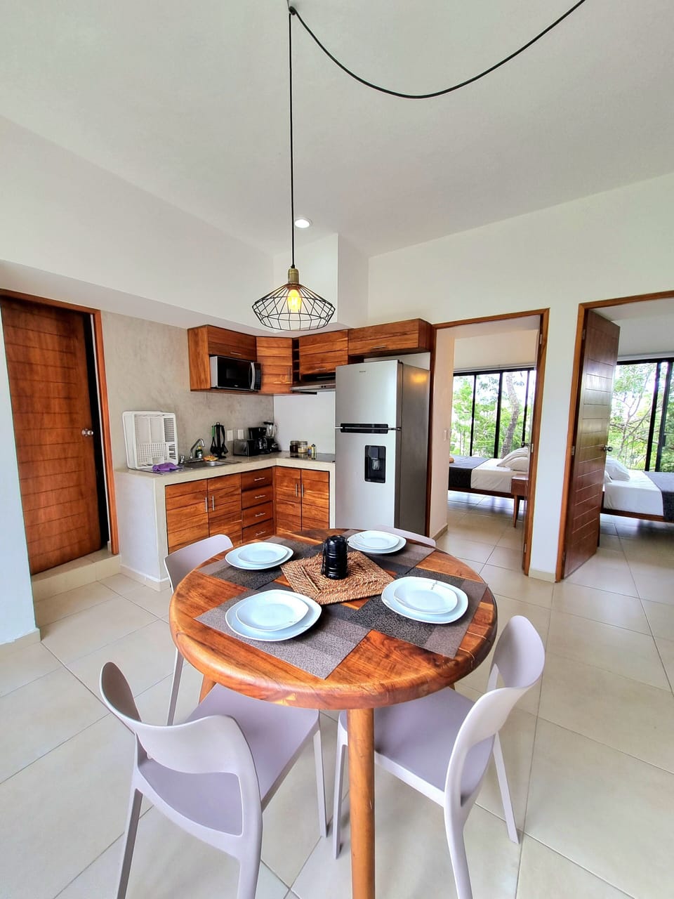 Deluxe Apartment, Multiple Beds, Non Smoking, Pool View | Private kitchen | Full-size fridge, microwave, stovetop, cookware/dishes/utensils