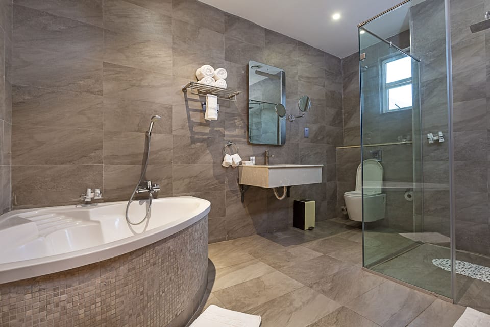 Deep soaking tub, rainfall showerhead, free toiletries, hair dryer