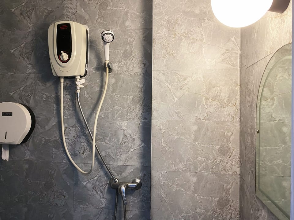 Quadruple Room | Bathroom | Shower, free toiletries, towels